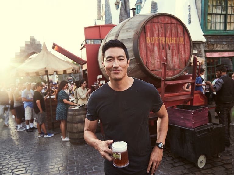Daniel Henney enjoys a Butterbeer™ at The Wizarding World of Harry Potter™