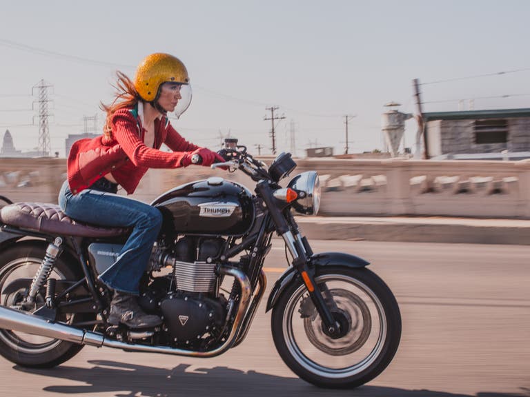 Motorcycle expert Irena Murphy crosses a bridge in Downtown L.A.