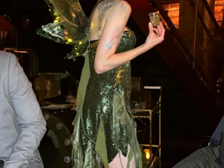 The green fairy serves absinthe to guests at The Edison in DTLA